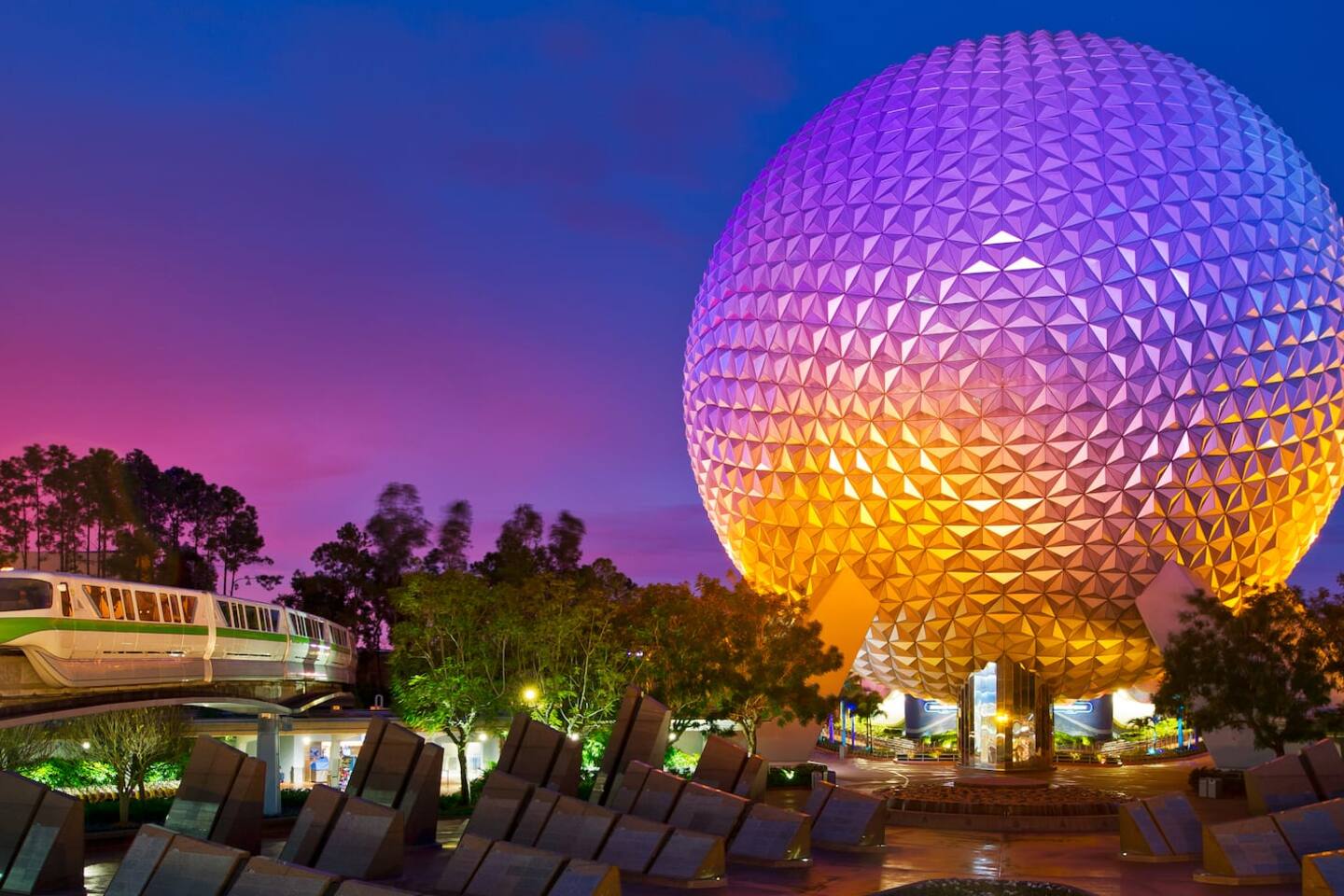 Spaceship Earth at EPCOT lit up at night